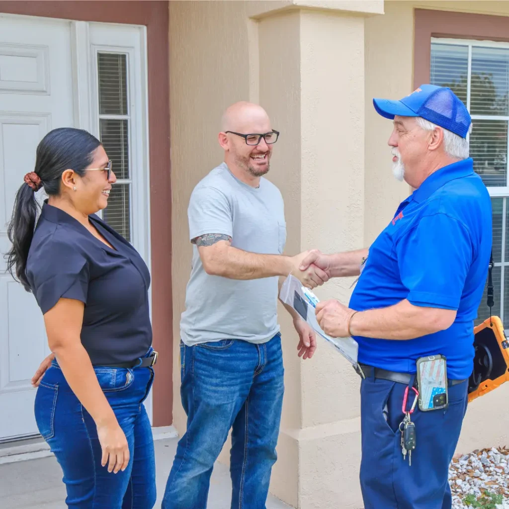 A friendly technician shaking hands with home resident.